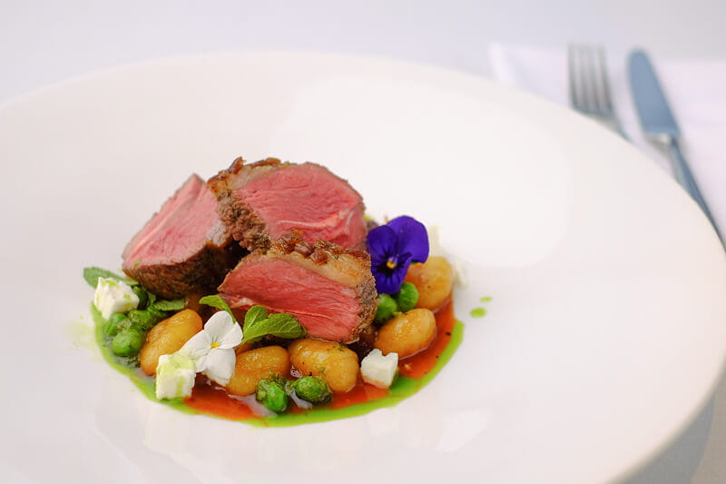 A colourful beef dish served in Club Lounge hospitality at The Queen's Club in 2022