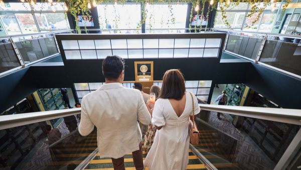Enter into Wimbledon hospitality, walking past the Venus Rosewater Trophy