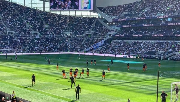 Players on the Tottenham Hotspur Stadium