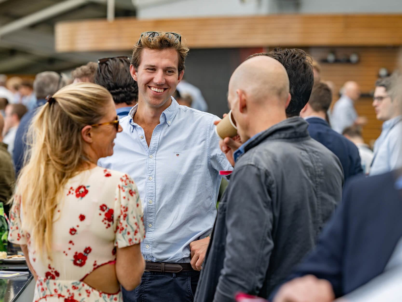 Guests chatting and enjoying hospitality on the Corinthian Roof Terrace at The Kia Oval cricket ground in London