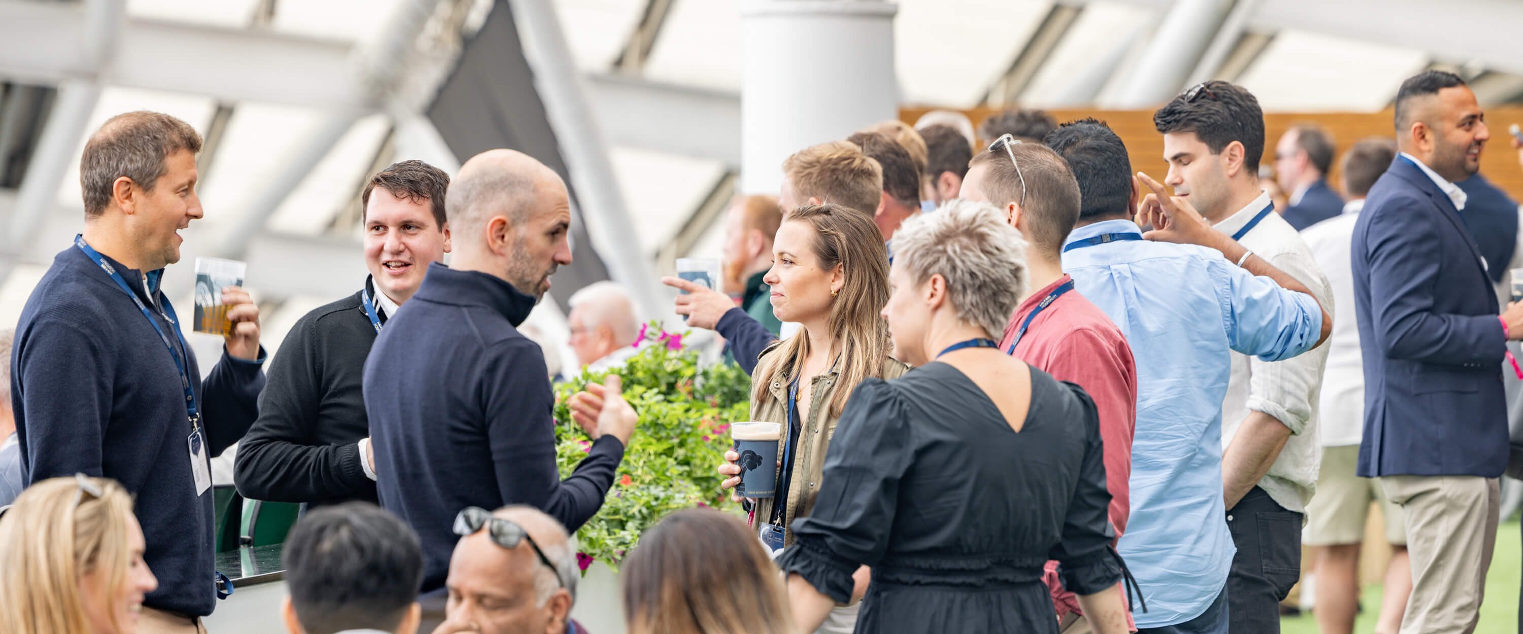 Guests socialising in hospitality in the Corinthian Roof Terrace at The Kia Oval cricket ground in London