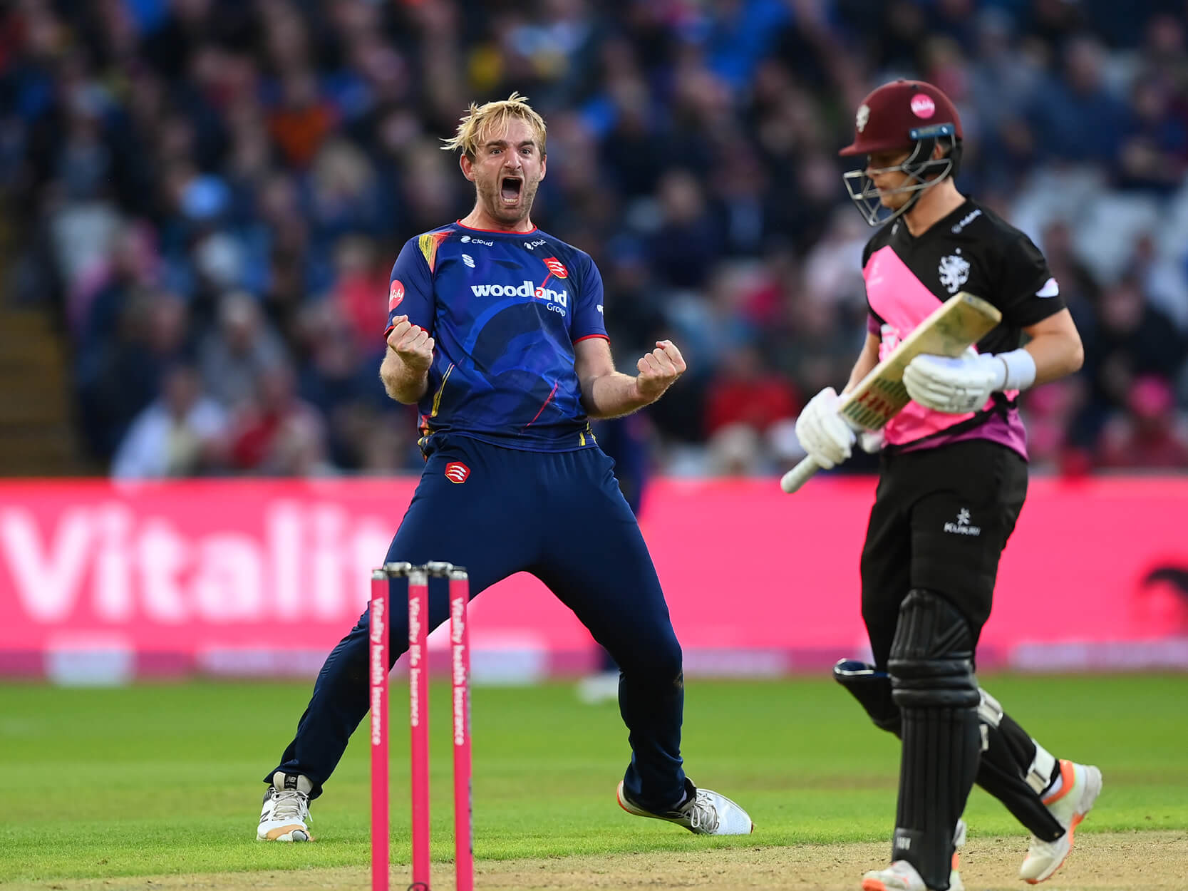Men's cricket players cheering and celebrating during the domestic T20 Finals Day match in 2023 at Edgbaston Stadium