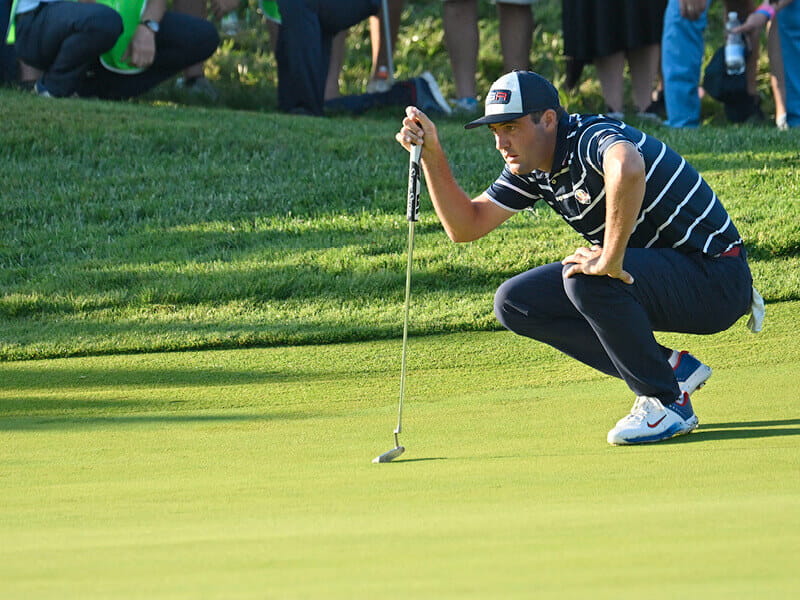 Golf player Scotty Scheffler playing in The Masters 2024 tournament on the course