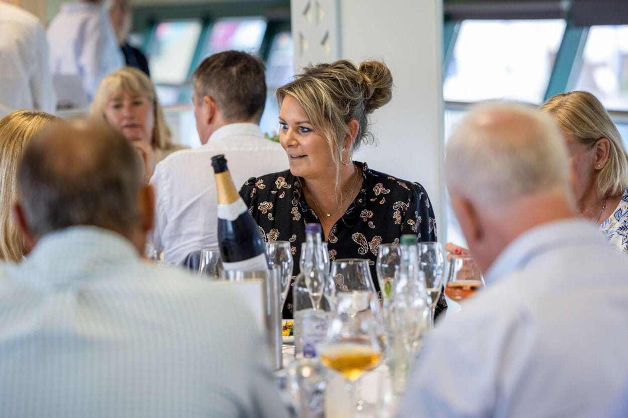Guests in hospitality chatting in The Sky Lounge at the Rothesay International Eastbourne tennis tournament