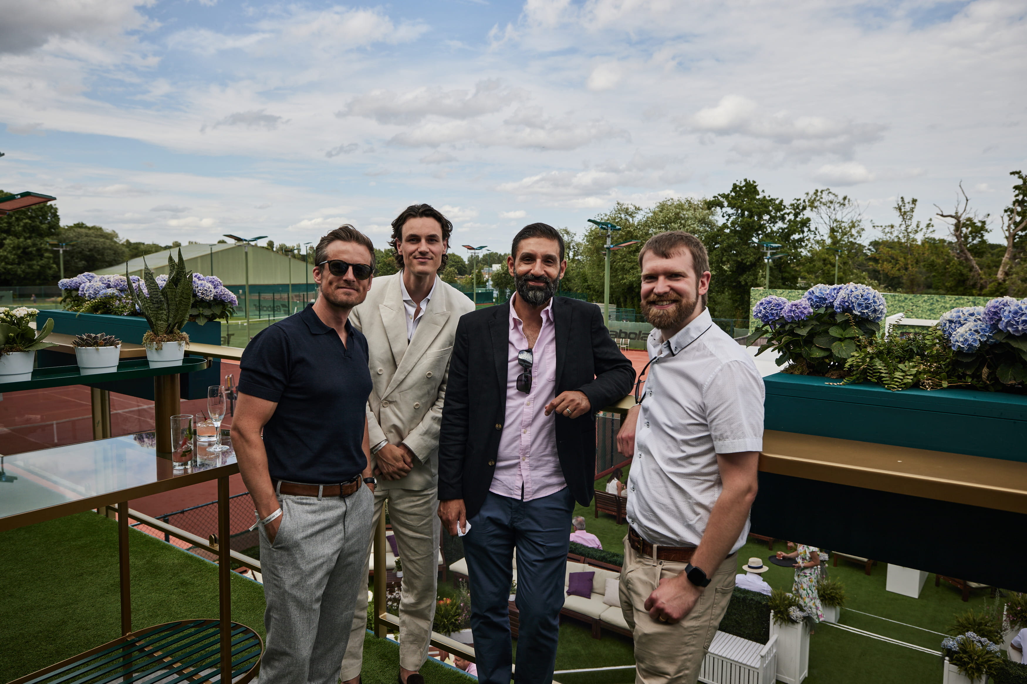 Guests on the balcony at the Treehouse at Wimbledon 