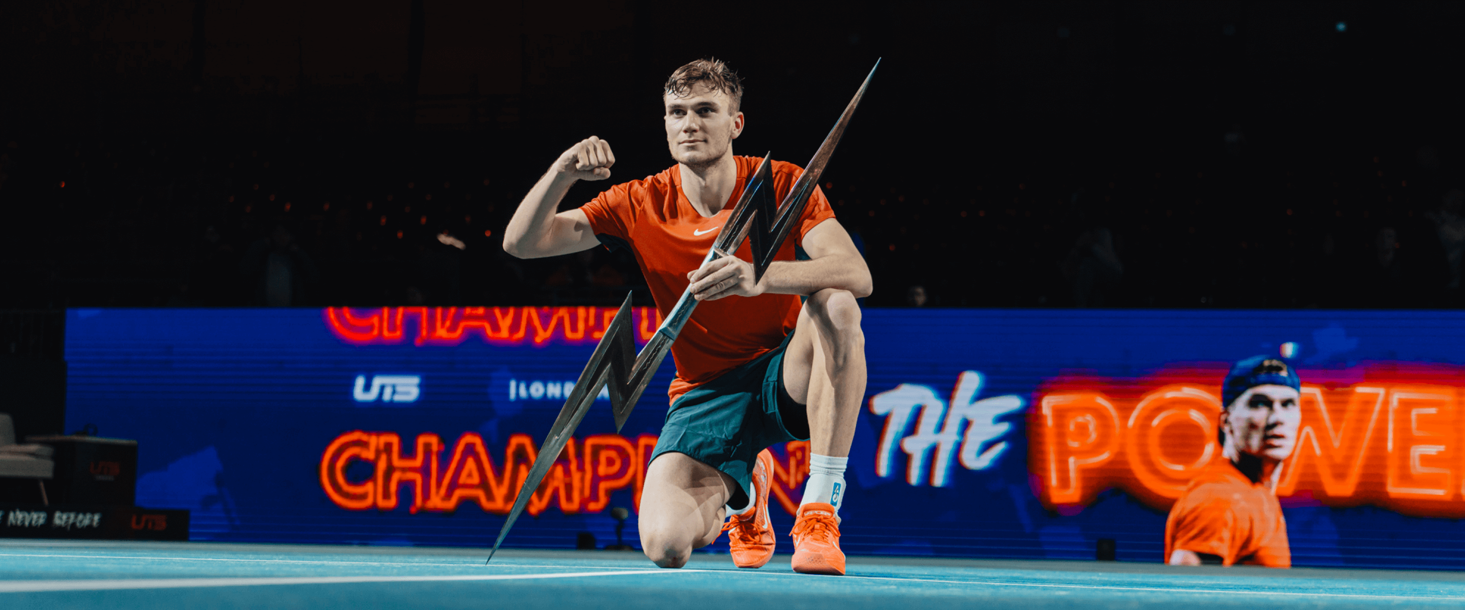 Winner of the UTS tennis league in 2023 and British tennis player Jack Draper smiling with the trophy at the UTS Grand Final London