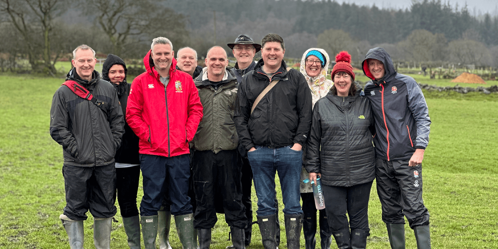Keith Prowse staff smiling outside at the BioHub day gardening
