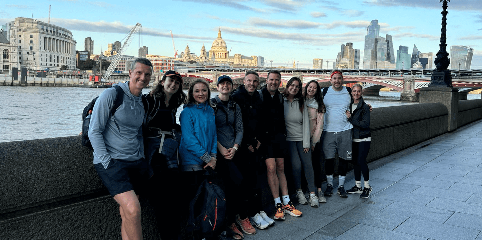 Keith Prowse staff smiling in London during the charity walk along the Thames Path for the Baobab Charity