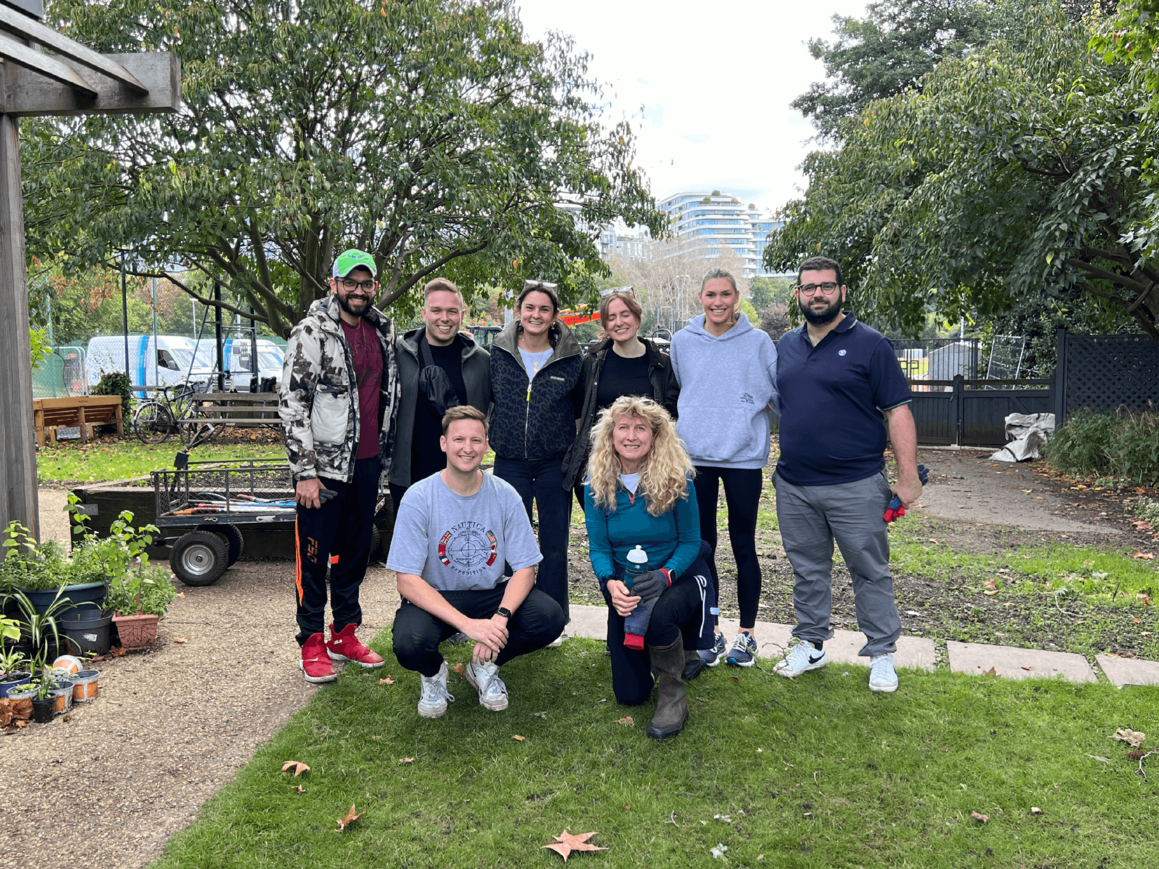 Staff from Keith Prowse and The Wimbledon Foundation smiling during their gardening day volunteering to support the Thrive charity in London