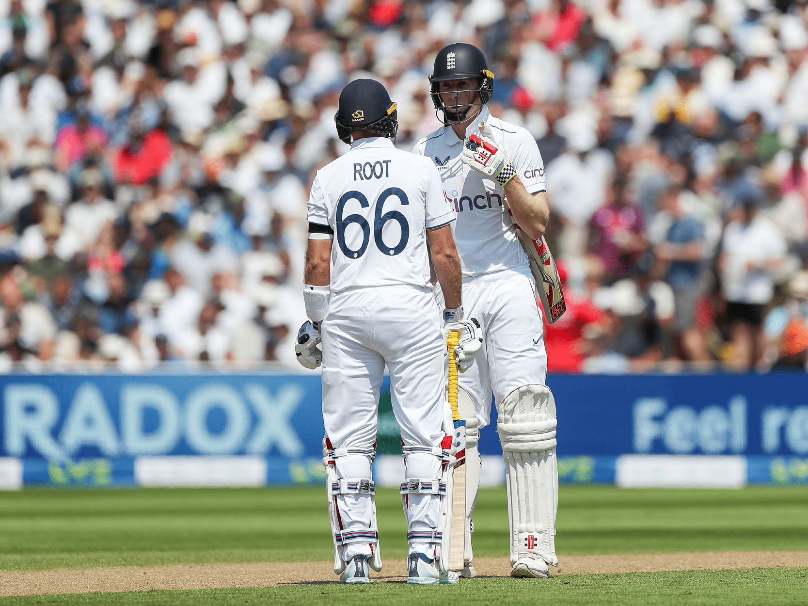 England cricket player Joe Root talking to his team mate whilst batting in a Test Match