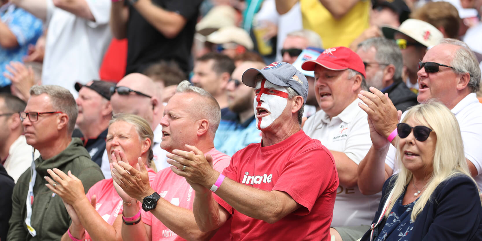crowd celebrates during a cricket match at Edgbaston Stadium