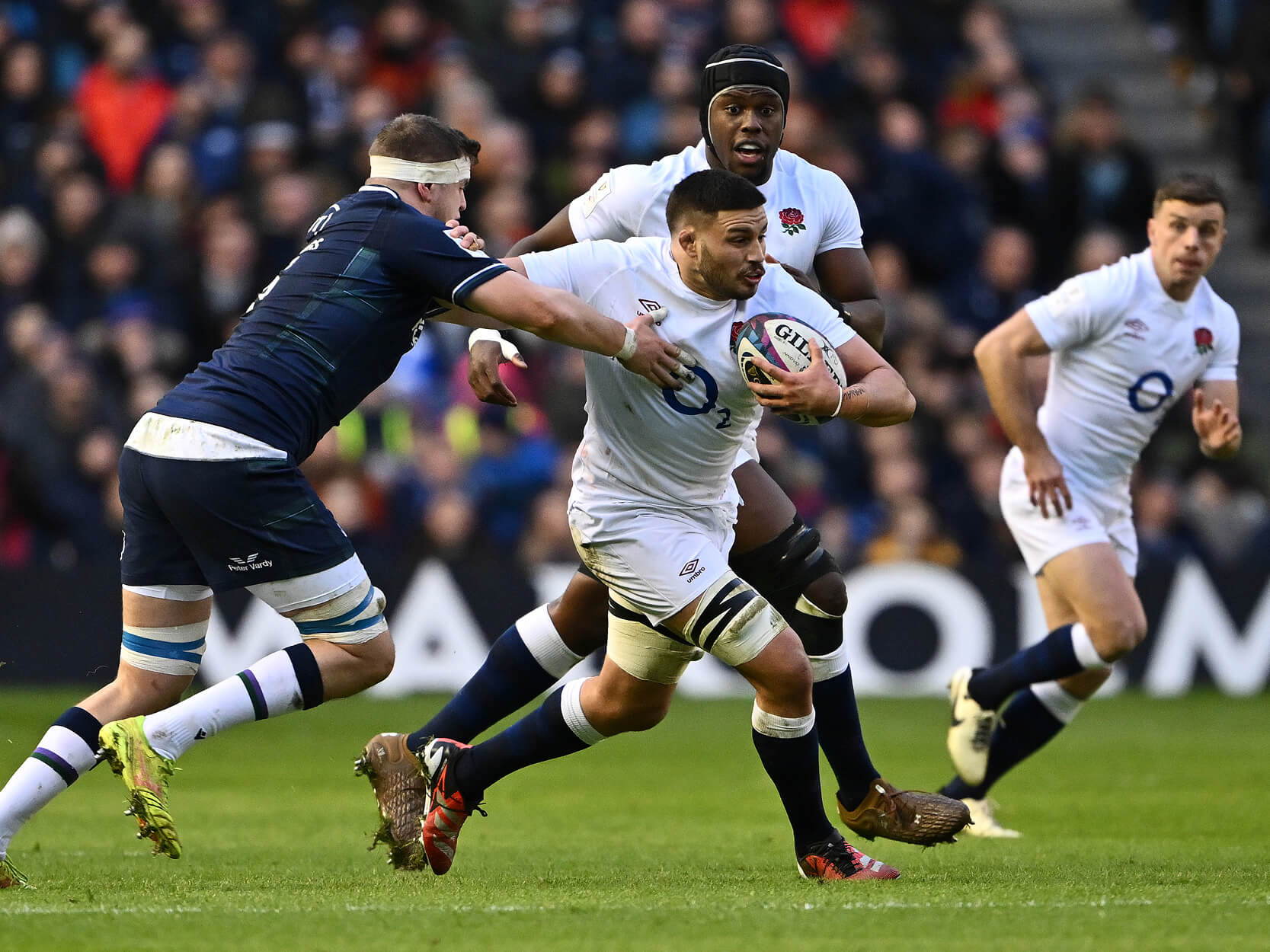 England rugby player Ethan Roots running with their ball during the England v Scotland match at Murrayfield Stadium for the 2024 Guinness Men's Six Nations