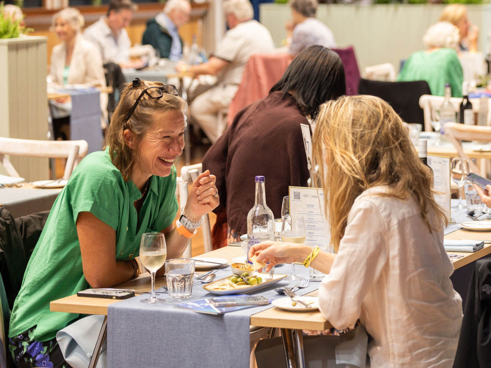 Guests chatting over lunch at the Rothesay International Eastbourne tennis in the Love Fifteen hospitality experience