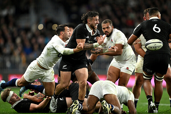 Ollie Lawrence tackles New Zealand player during England v New Zealand test