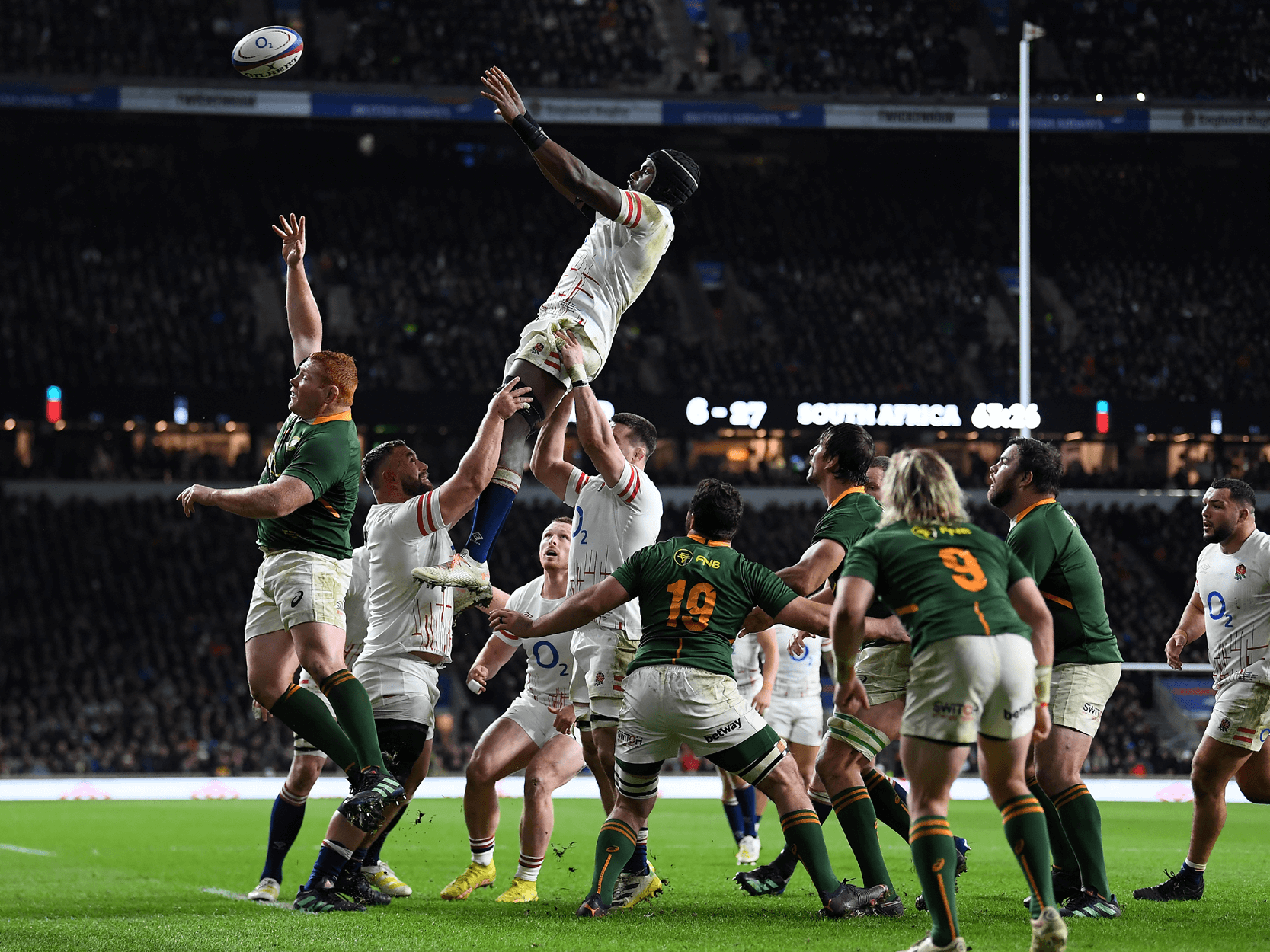 Maro Itoje jumping for the ball in a line out during a match against South Africa at Twickenham Stadium
