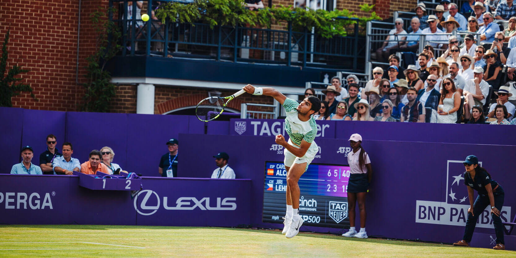 Wimbledon 2023 winner and cinch Championships 2023 winner Carlos Alcaraz hitting the ball on Centre Court at the Queen's Club
