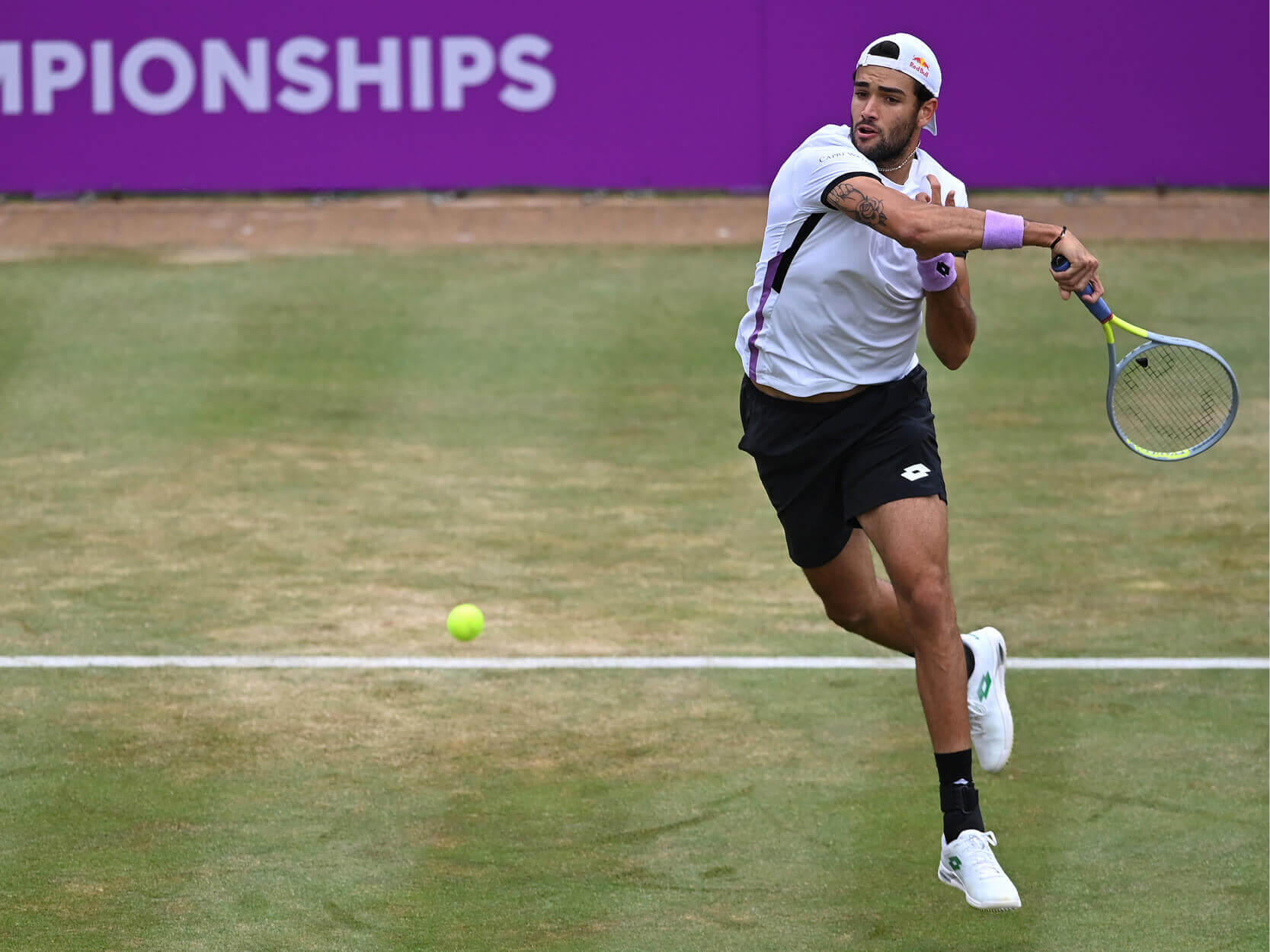 2021 and 2022 Queen's Club Championships winner Matteo Berrettini hitting the ball at the cinch Championships