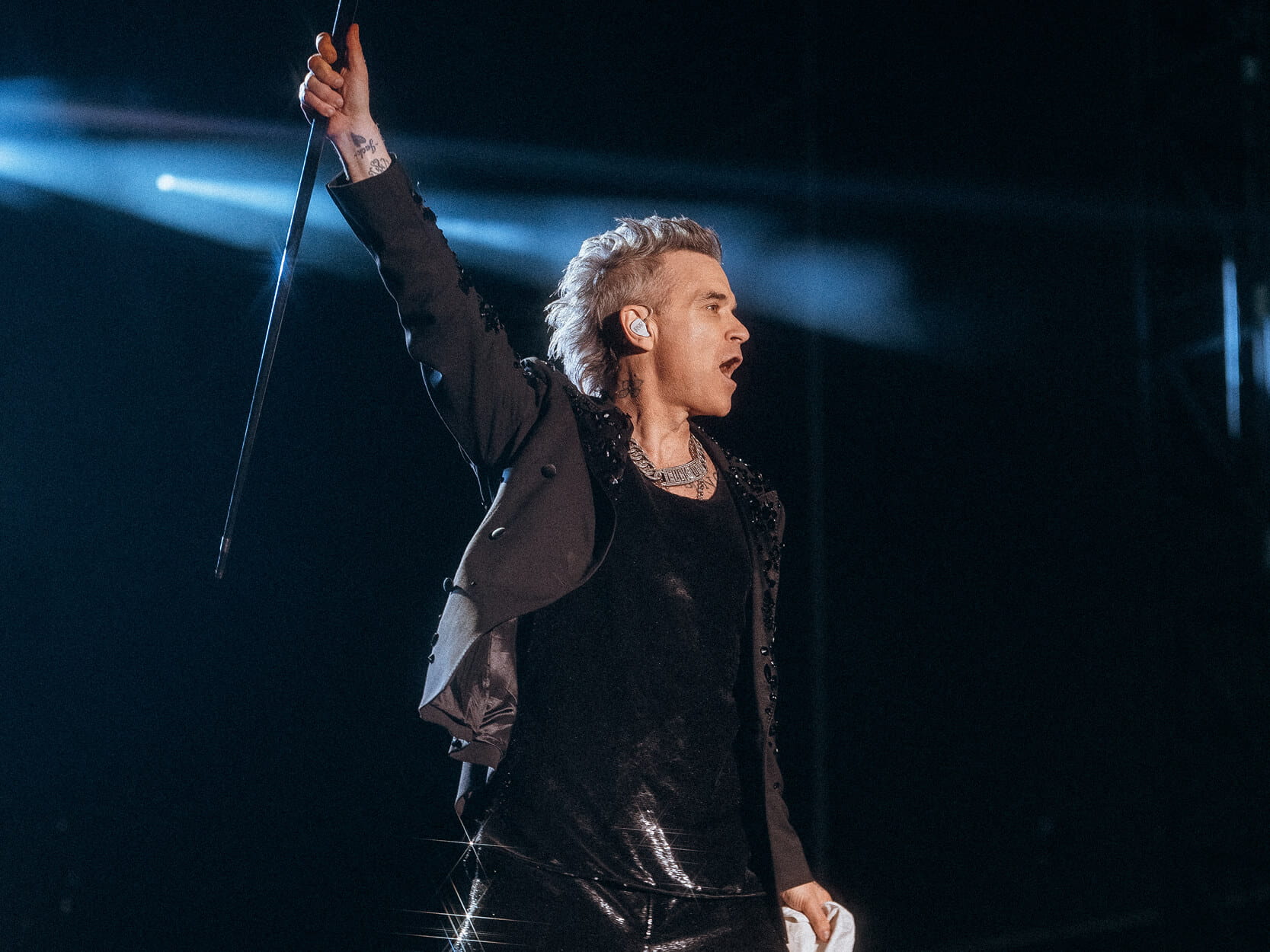 Singer and former Take That band member Robbie Williams performing on stage at a concert