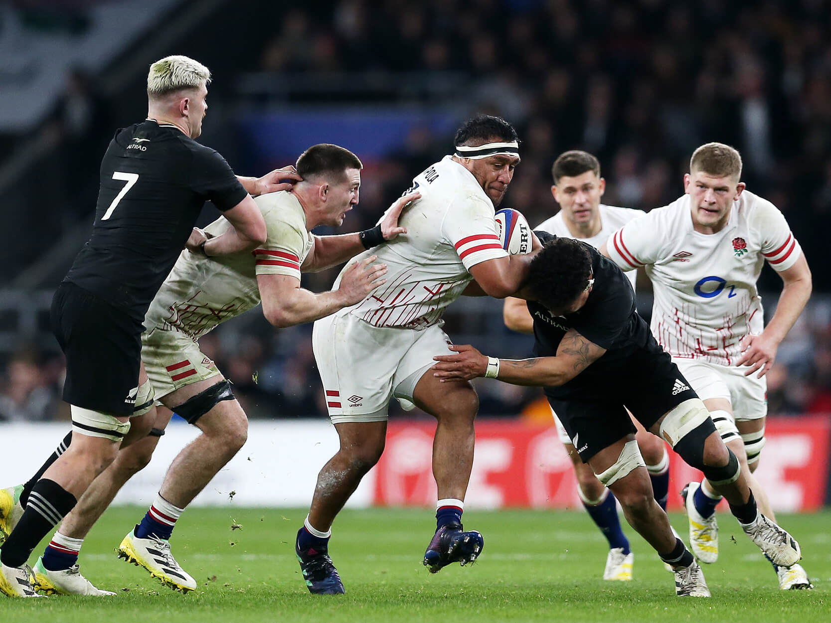 England Rugby player Mako Vunipola running with the ball during a tackle against New Zealand at Twickenham Stadium in the Autumn Nations Series