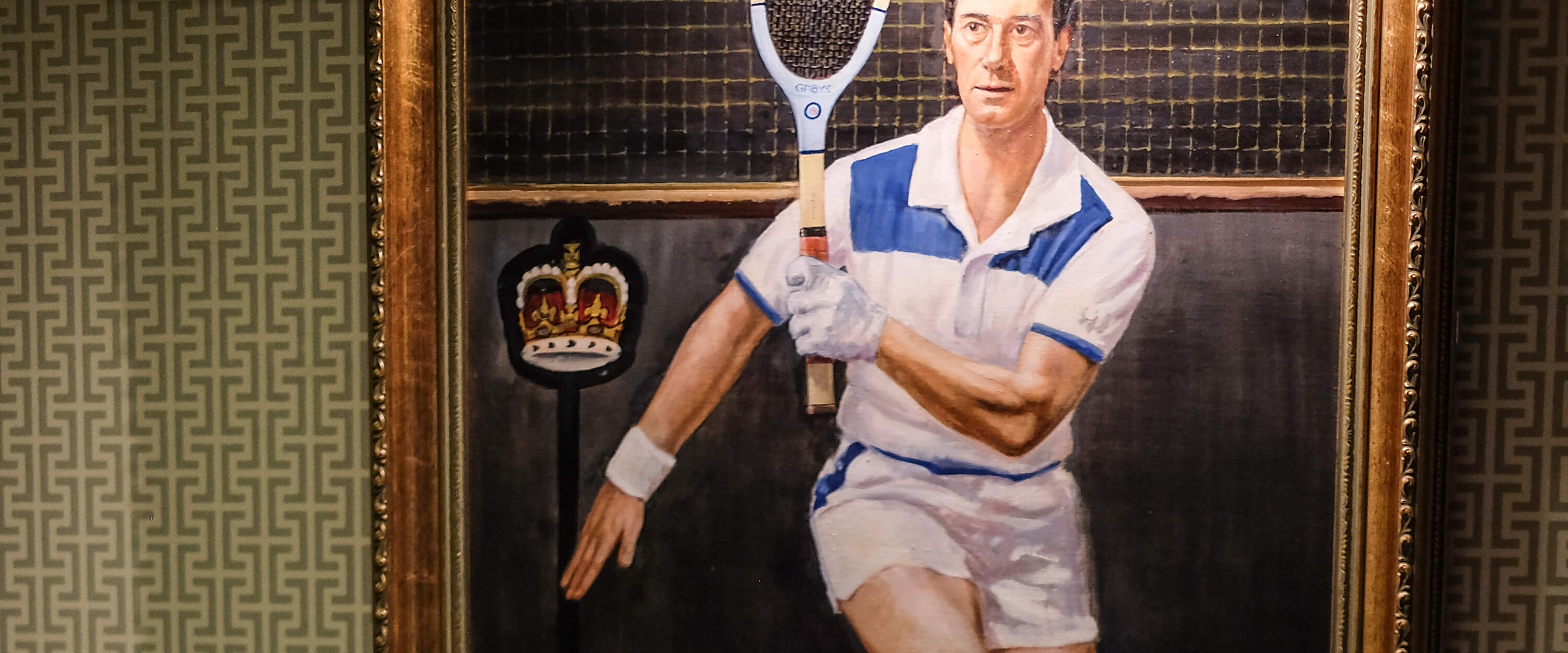 A historic painting of a tennis player using an old wooden tennis racket inside a room at the Queen's Club tennis club 