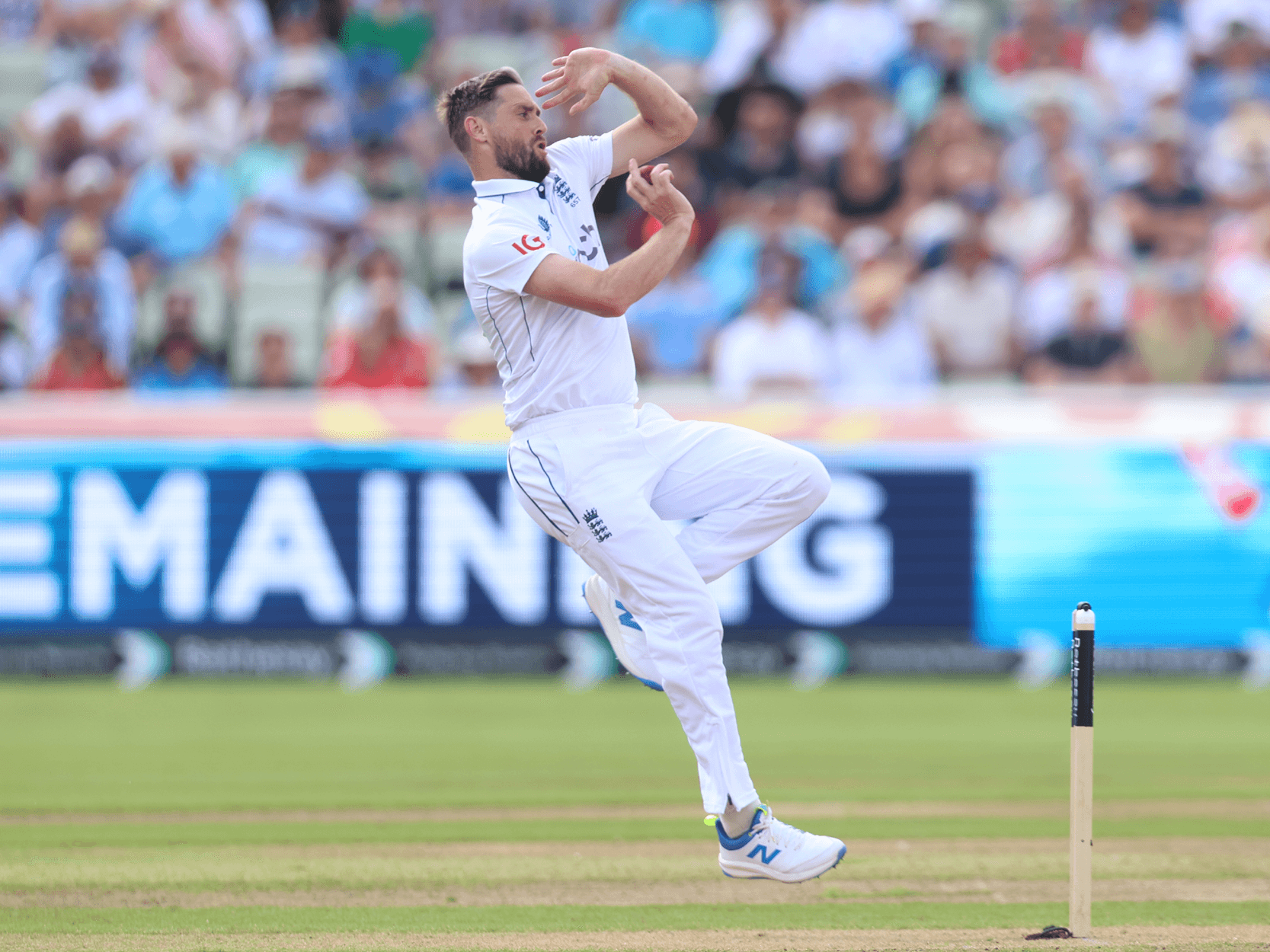 England cricketer Chris Woakes bowling during a test match series at Edgbaston Stadium