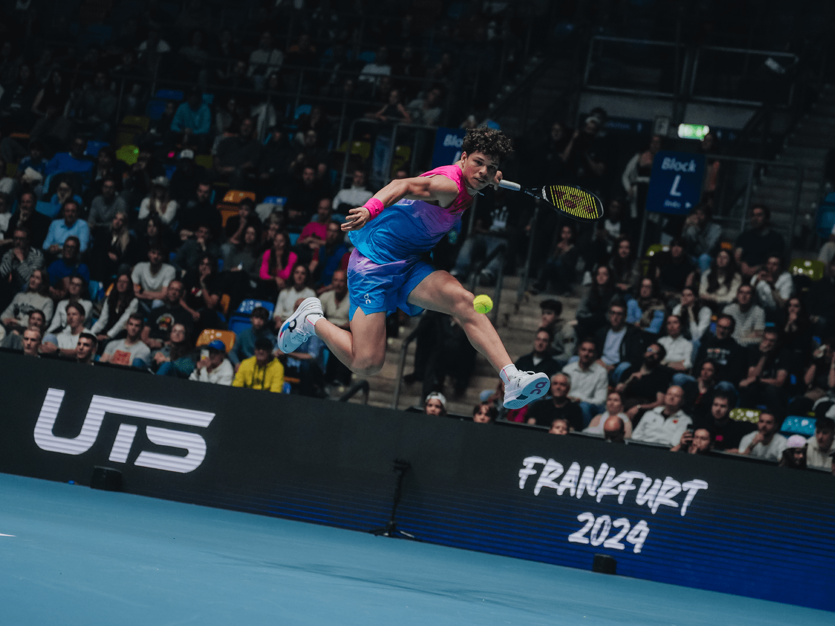 American tennis player Ben Shelton jumping to hit the tennis ball at the UTS Frankfurt event in 2024
