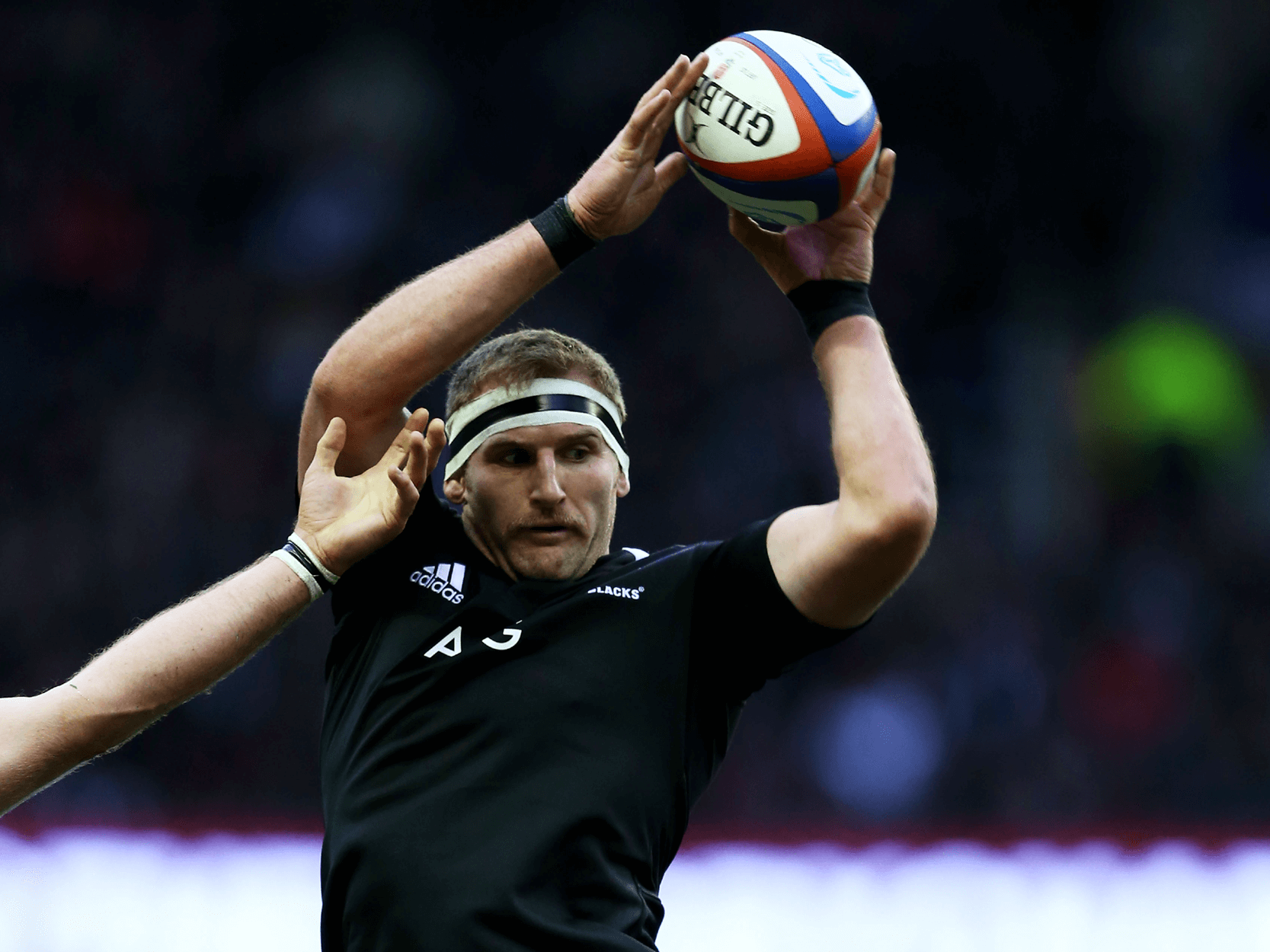 New Zealand rugby player Kieran Read holding the ball during a rugby match for the All Blacks