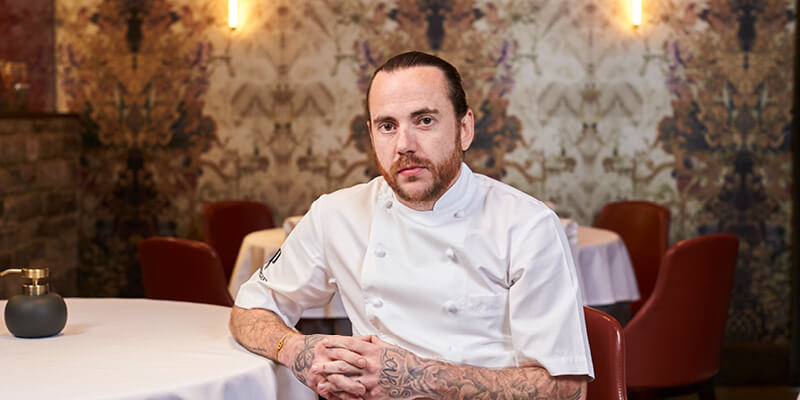 Tom Sellers from Restaurant Story cooking in The Treehouse Facility at The Championships Wimbledon