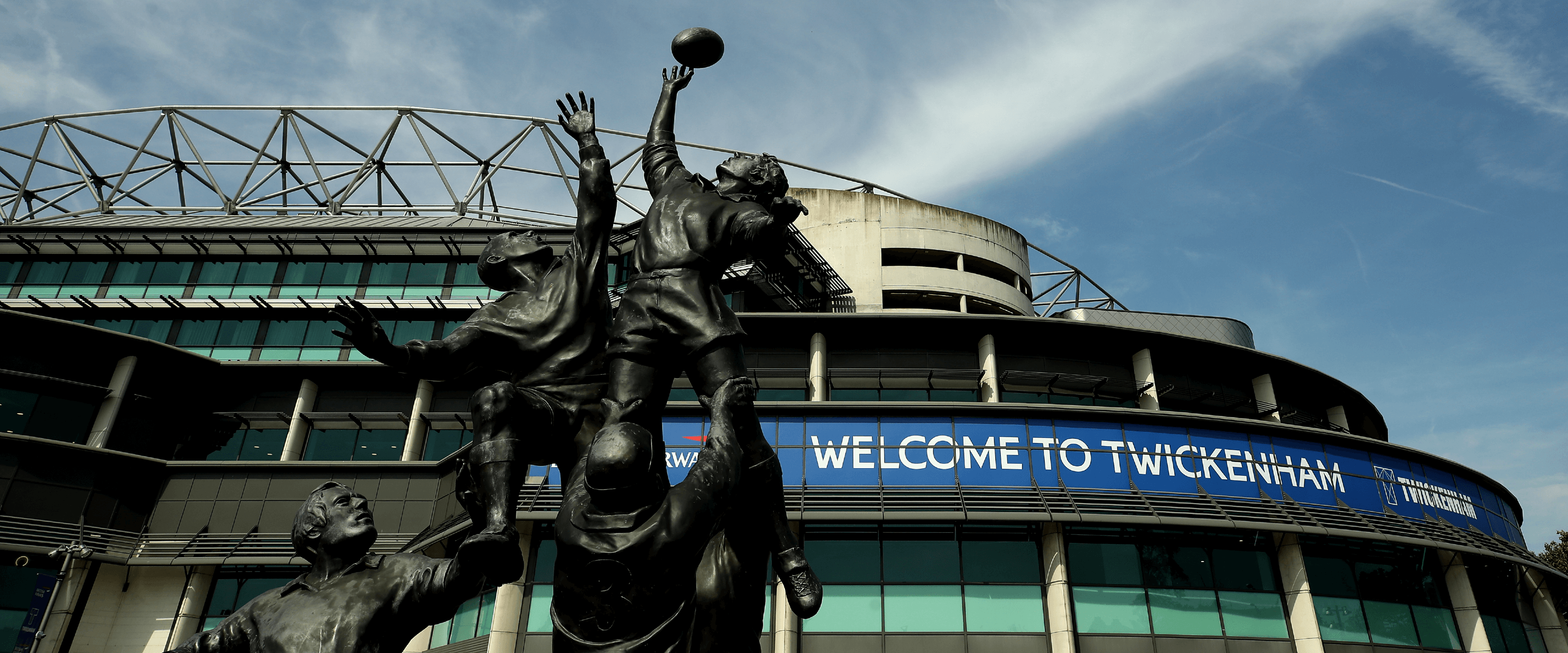 Front of the Allianz Stadium previously Twickenham Stadium rugby venue with statue at the entrance