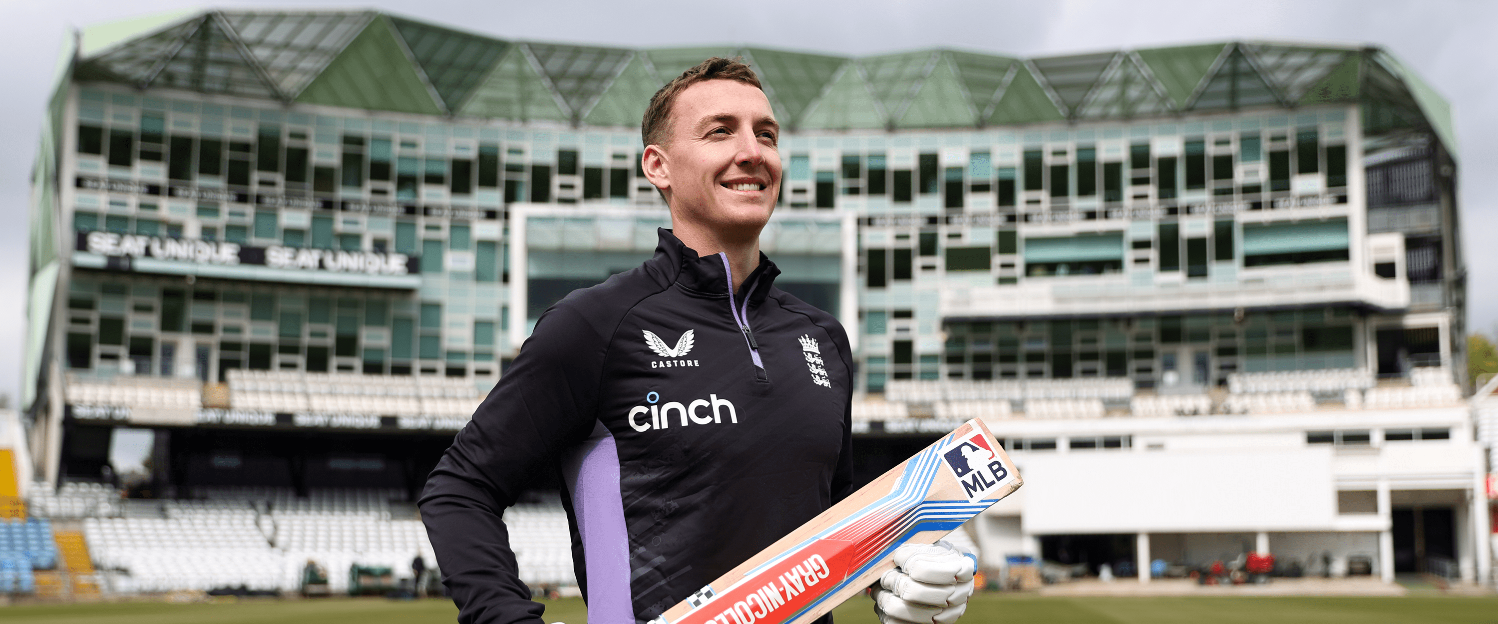 England white ball cricket captain Harry Brook smiling for the announcement of becoming captain on the pitch holding a cricket bat