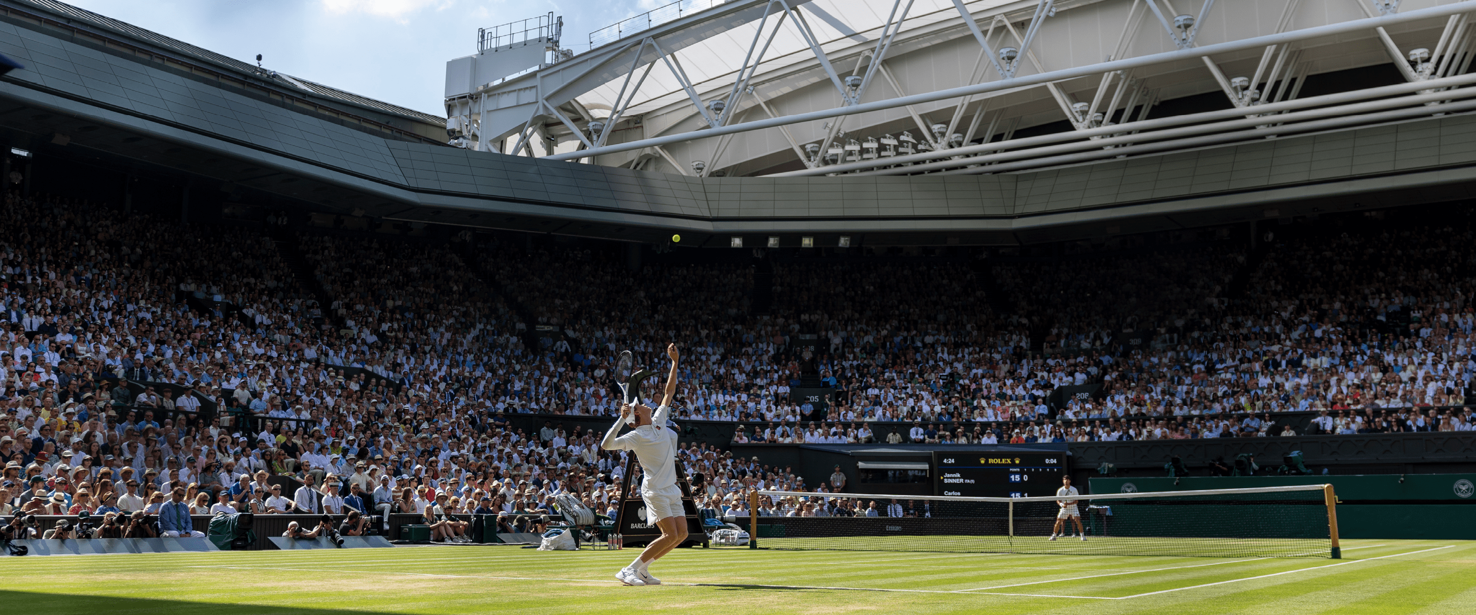 Tennis player Jannick Sinner serving during a match on Centre Court at Wimbledon in 2025 for the men's final