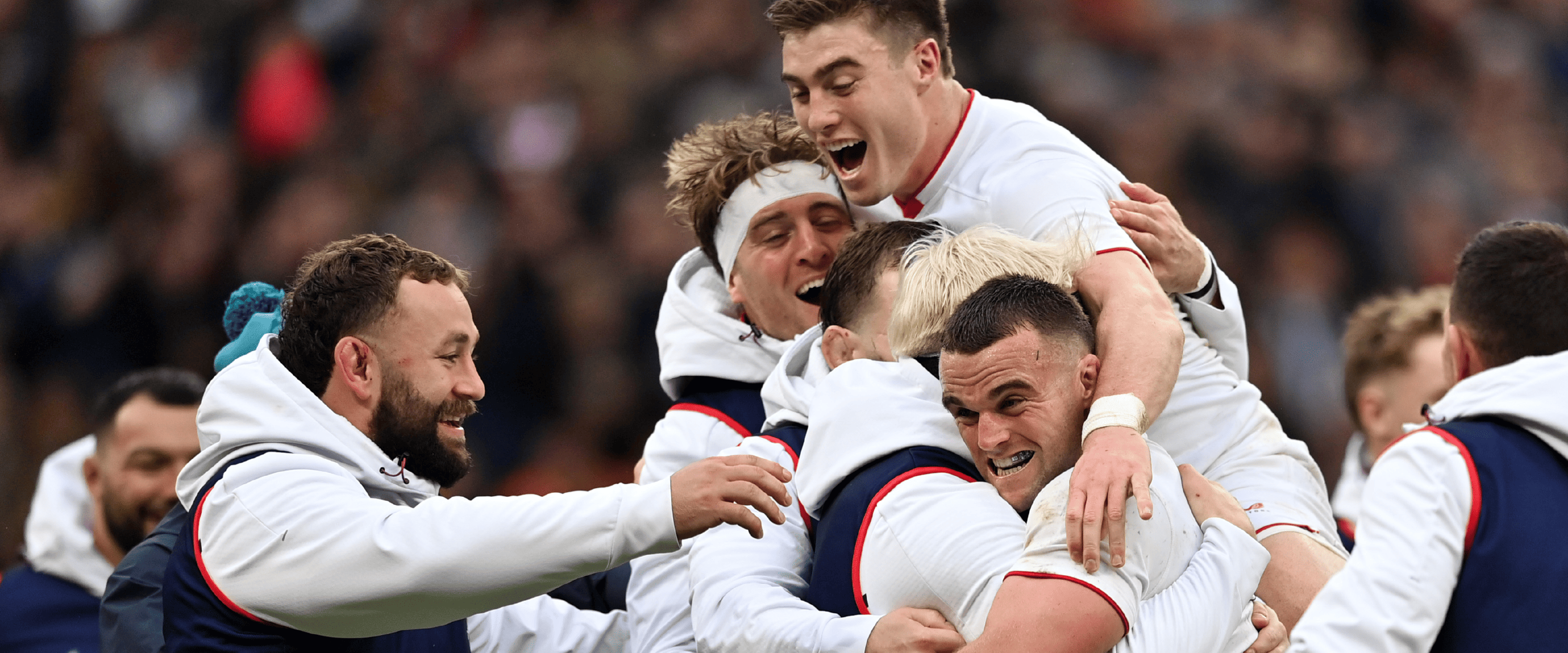 The England Rugby men's team cheering and huddling together after a win in a match at Allianz Stadium, Twickenham