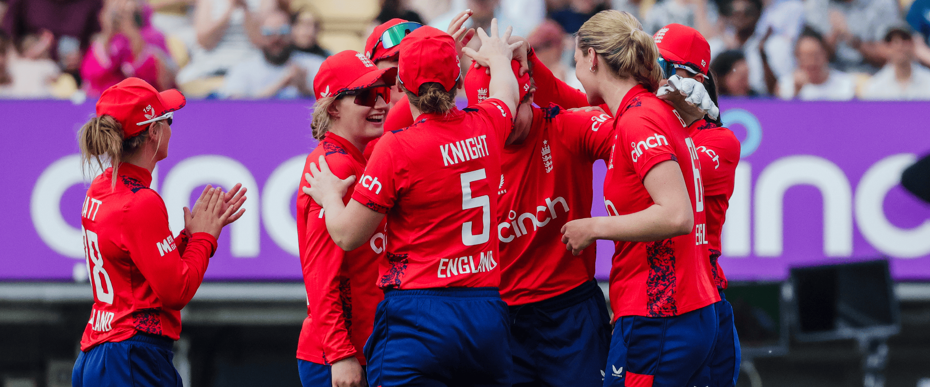 England women's cricket team smiling and celebrating a win in an IT20 match