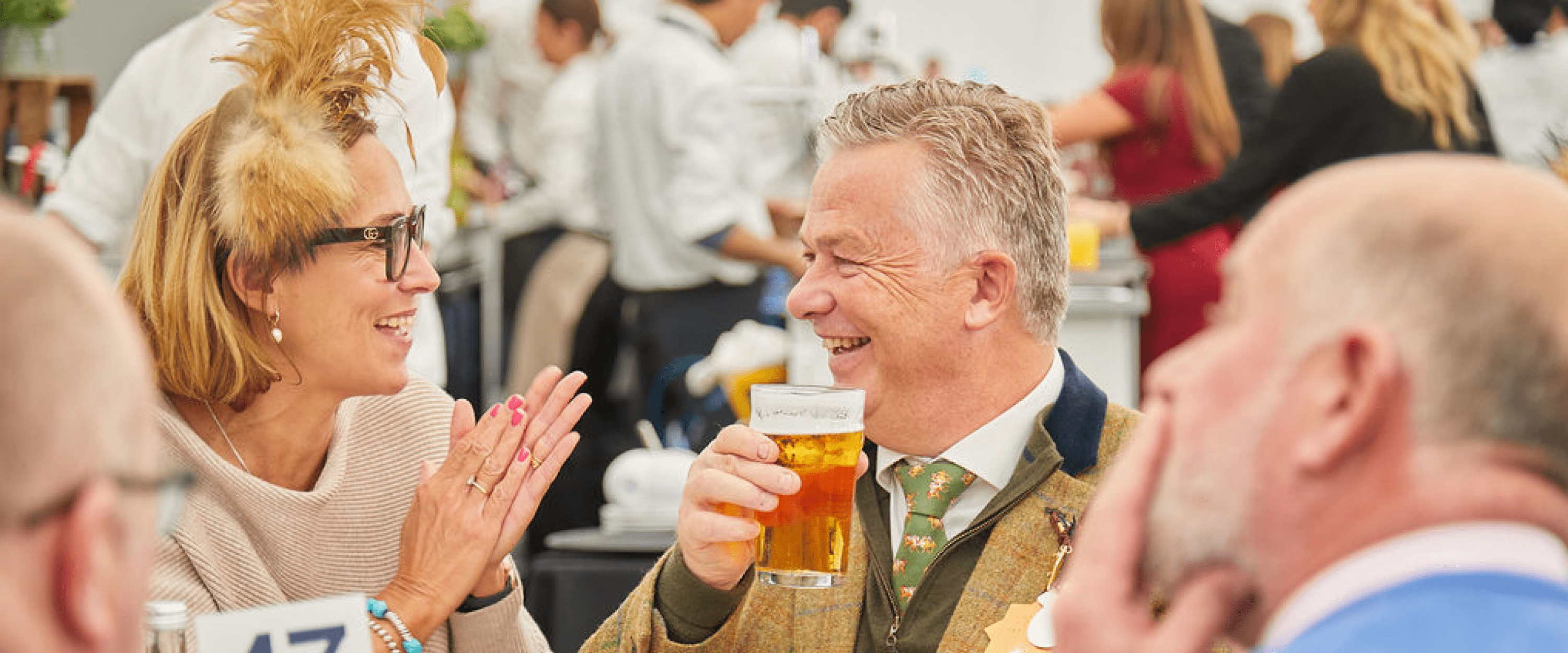 Guests chatting in the Platinum Suite Marquee at Cheltenham Festival horse racing event