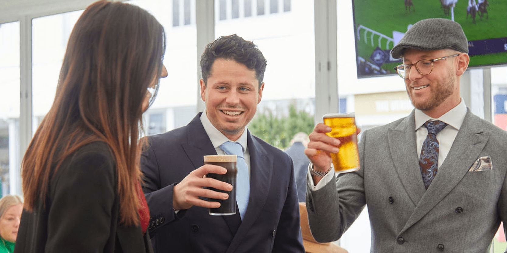 Guests in hospitality at Cheltenham Festival for a horse racing event with drinks