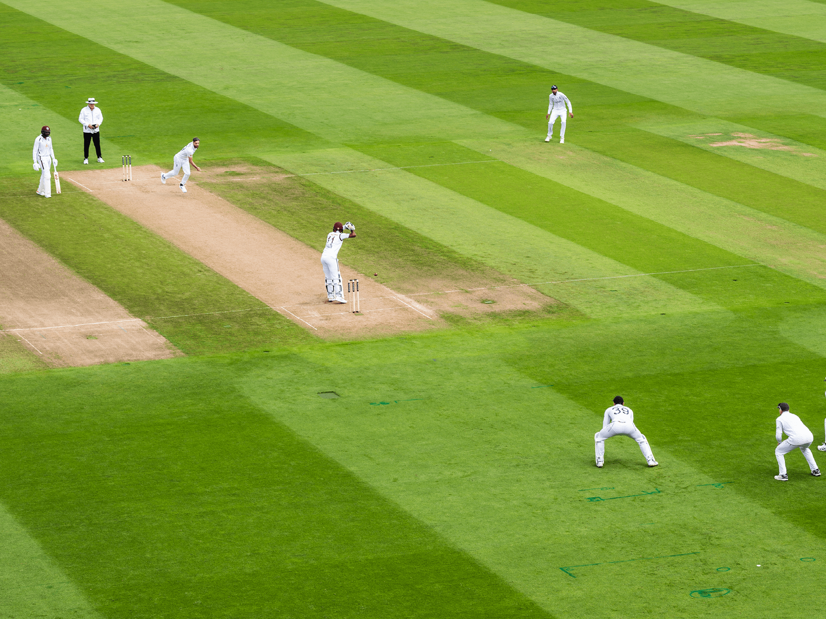 England cricket team playing in a Test match on the pitch against the West Indies at Edgbaston Stadium
