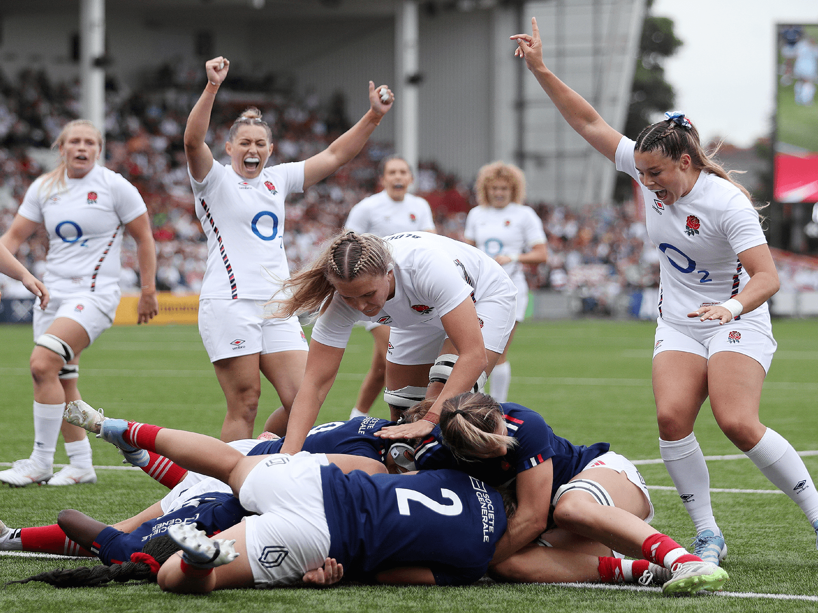 England's Red Roses rugby players scoring a try against France in the Guinness Women's Six Nations 2024