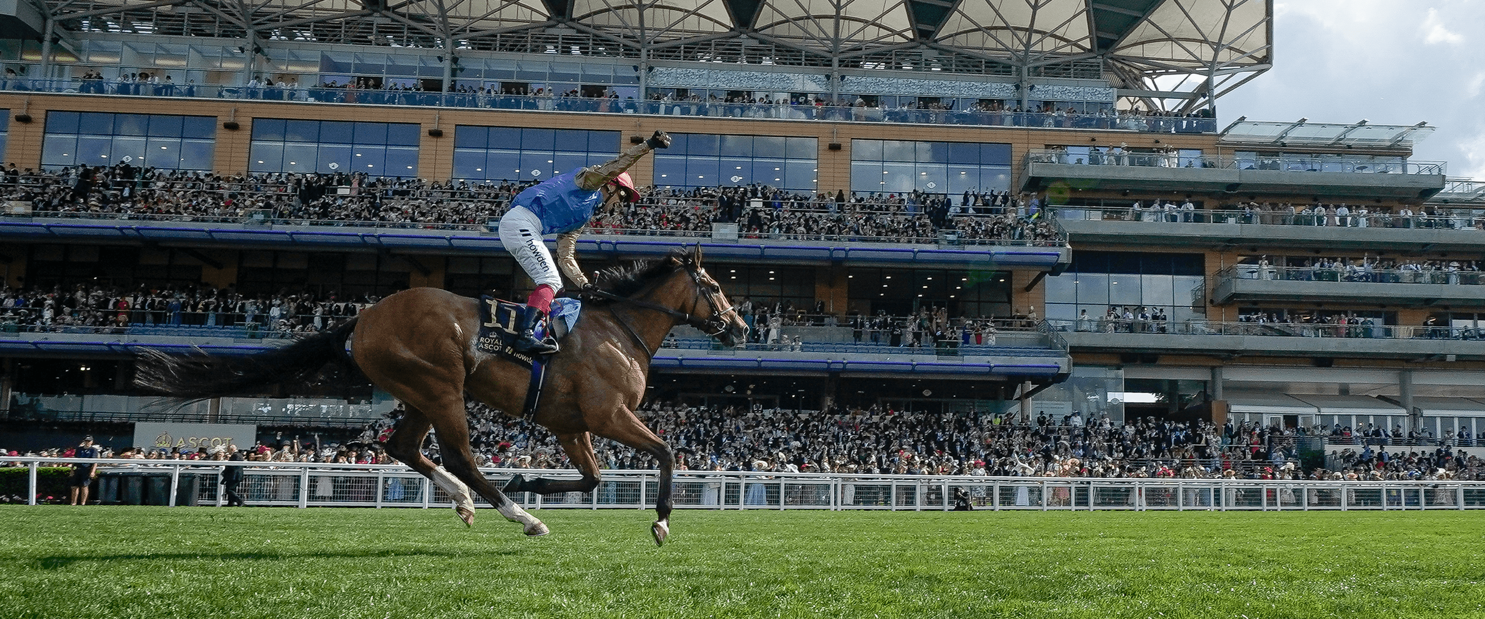Horse racing jockey Frankie Dettori crossing the finish line at Ascot Racecourse for the 2023 Gold Cup event