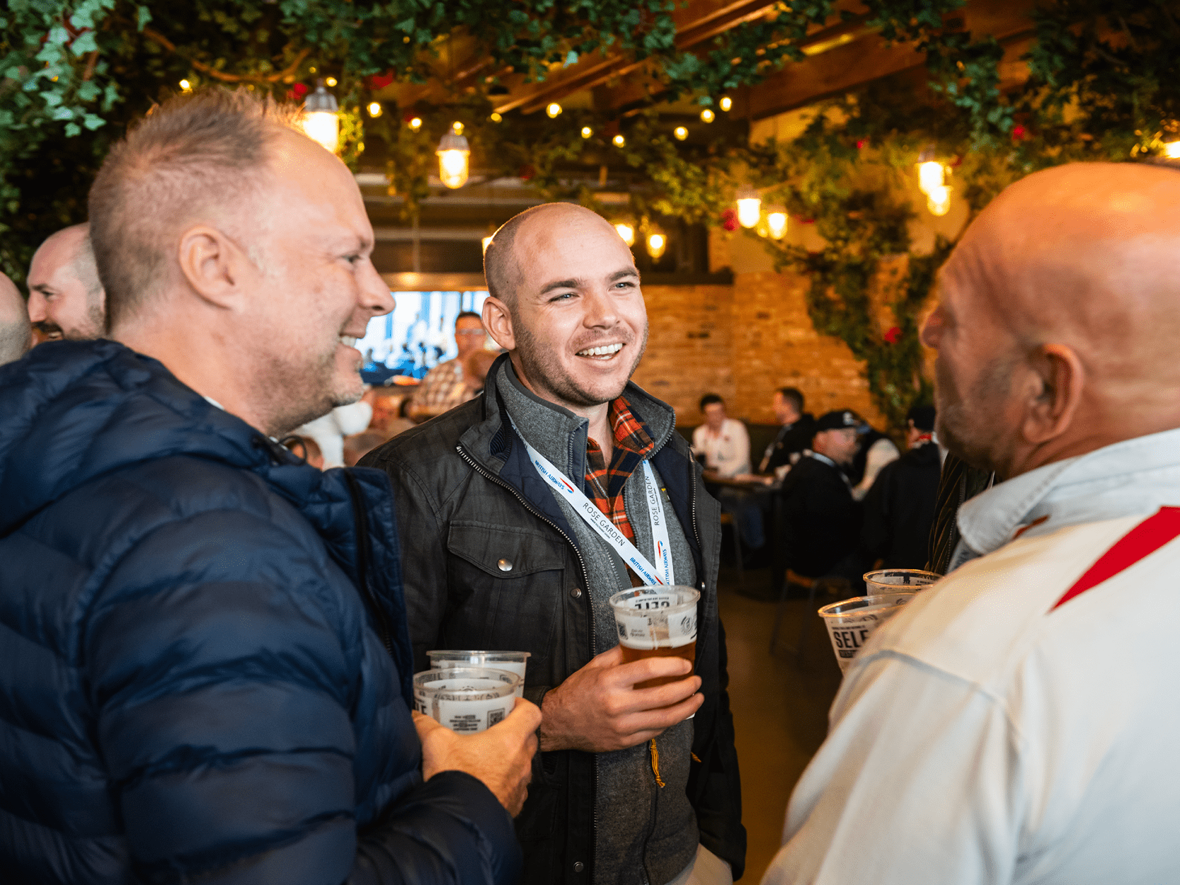 Guests chatting in British Airways Rose Garden hospitality at an England Rugby match at Allianz Stadium, Twickenham