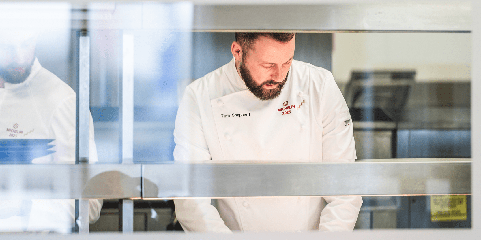 Chef Tom Shepherd plating up and cooking in the kitchens at Edgbaston for his menu tasting