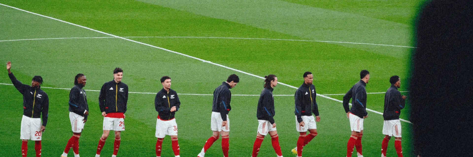 Arsenal players on pitch 