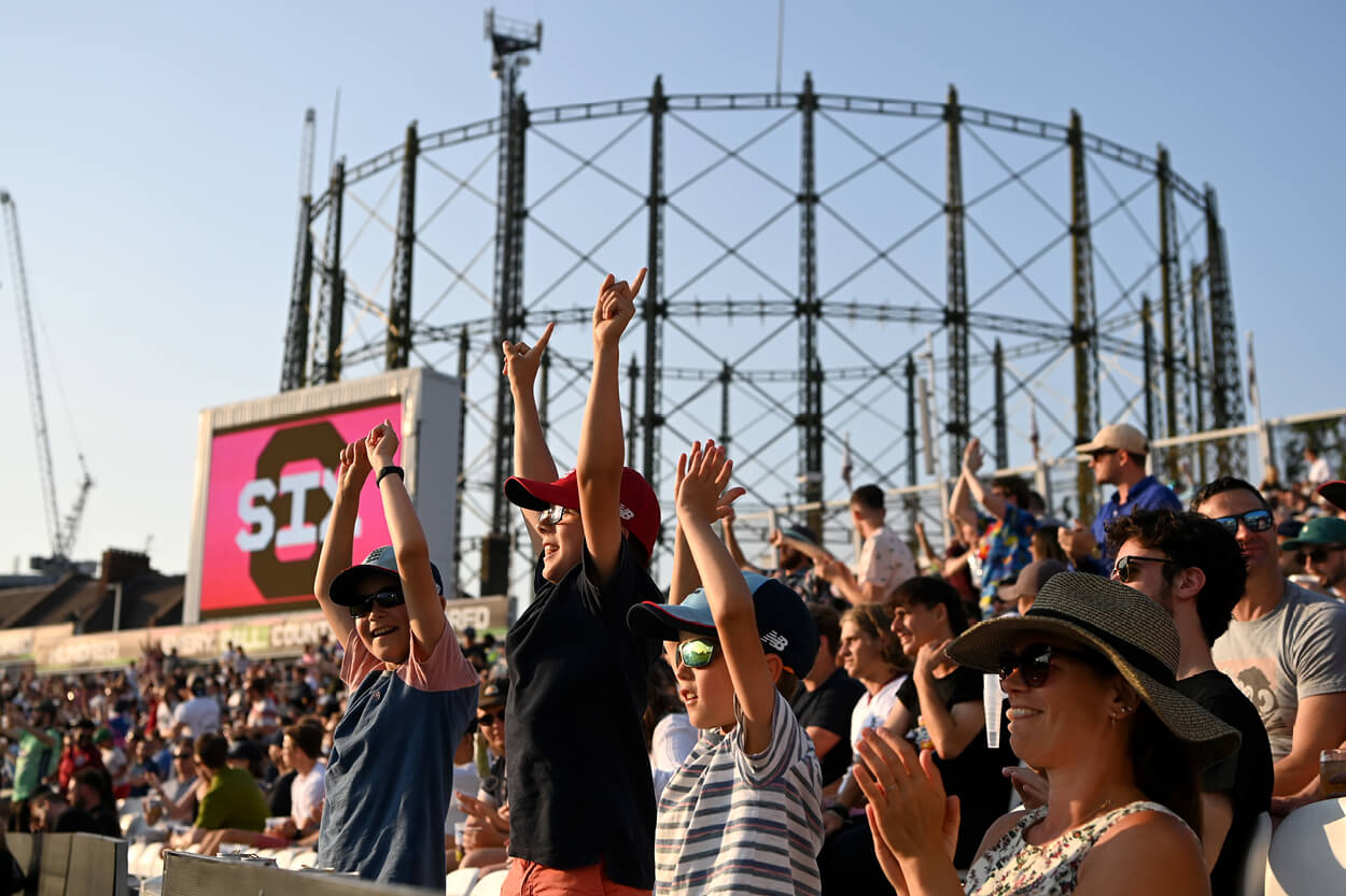 Fans celebrating at the Oval during a cricket match