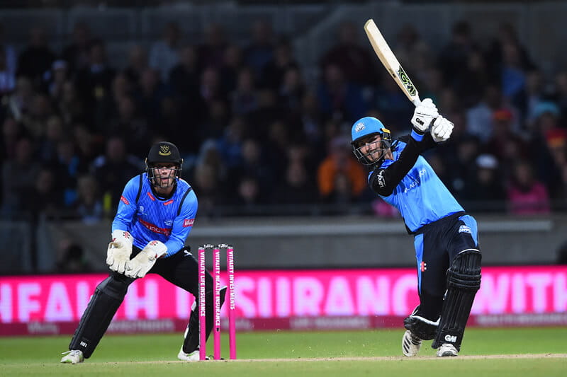 County cricket player hitting a boundry