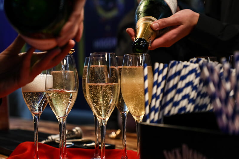 Champagne being poured at the Cazoo Masters hospitality suites