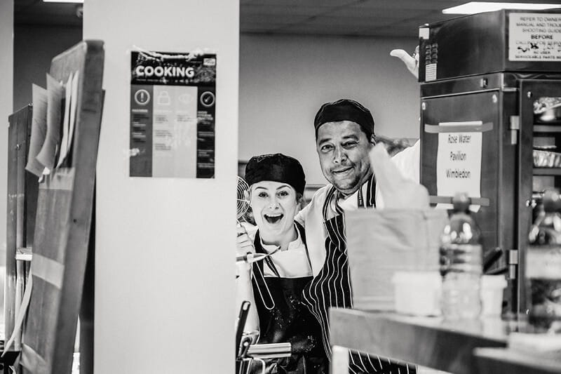 Chefs smiling in the kitchen at Wimbledon for Rosewater Pavilion hospitality