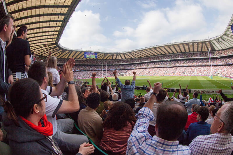 Crowds cheering at Twickenham Stadium
