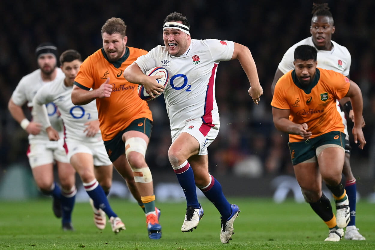 England rugby player Jamie George running with the ball against Australia