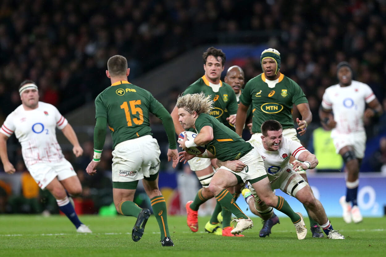 South Africa Rugby playing England in the 2022 Autumn Nations Series with Faf de Klerk running with the ball 