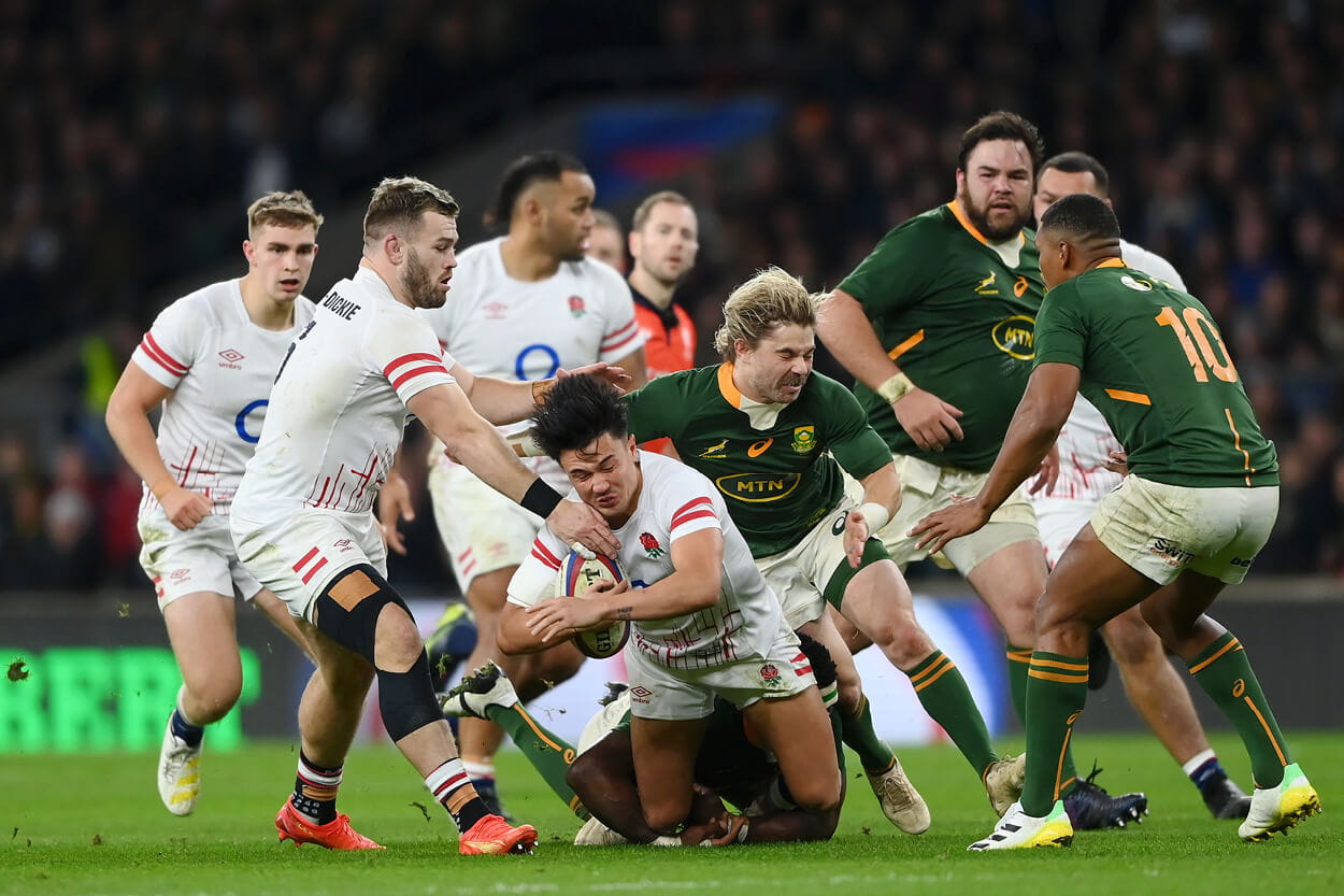 England and South Africa rugby match in the Autumn Nations Series 2022 where Marcus Smith is being tackled by Faf de Klerk at Twickenham Stadium