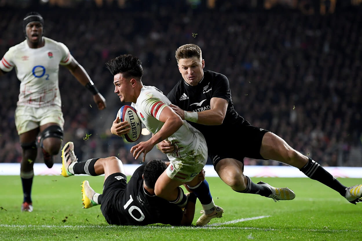 England rugby players Marcus Smith and Mark Itoje playing against the All Blacks and Jordie Barrett at Twickenham Stadium in the Autumn Nations Series 2022